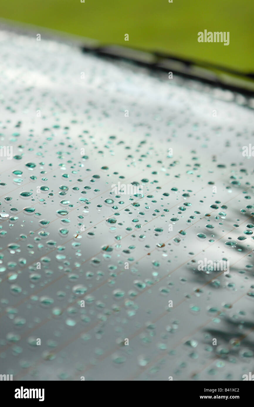 Raindrops on the rear back window of a motor car vehicle Stock Photo ...