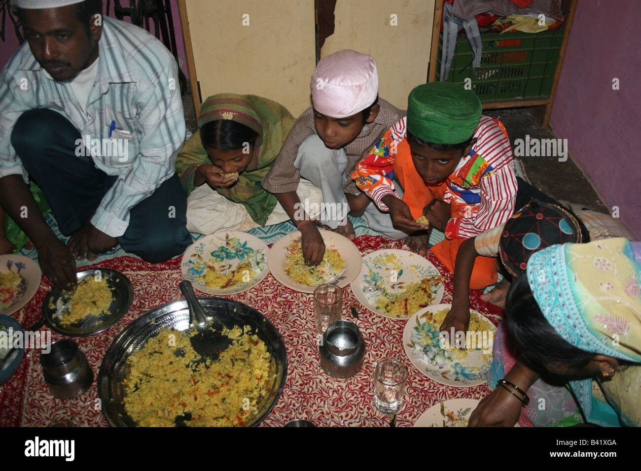 Extended Muslim family enjoying the Iftar evening meal during Ramadan