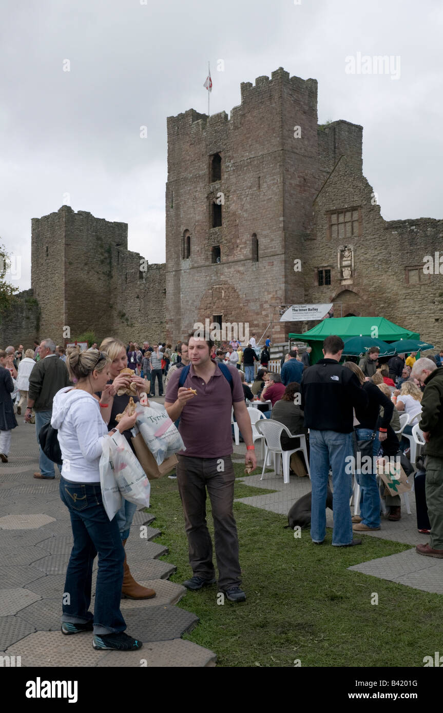 People eating Inside the castle at the Food festival Ludlow Shropshire England UK Stock Photo
