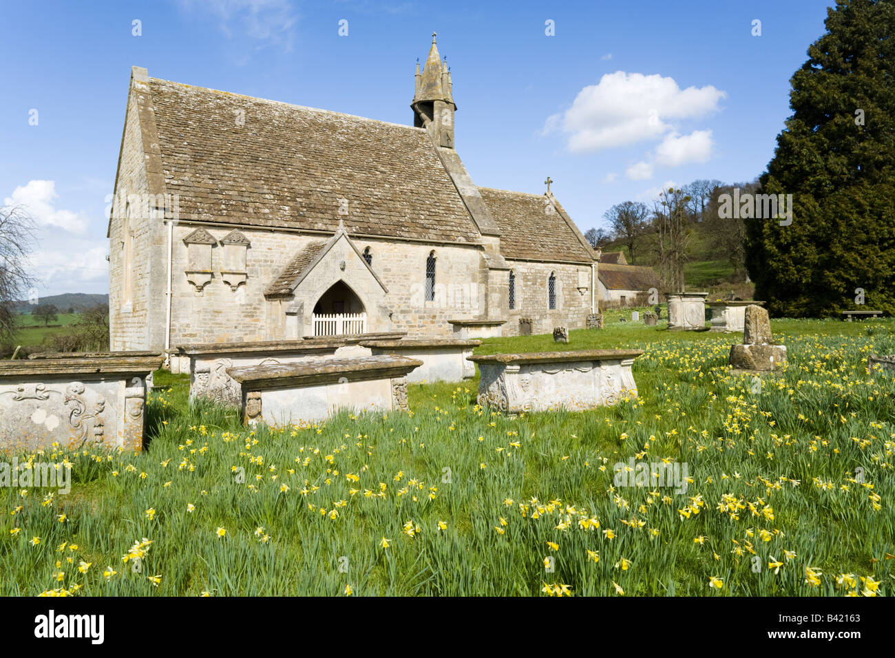 The church of St John the Baptist lying at the foot of the Cotswold scarp in the village of Harescombe, Gloucestershire Stock Photo