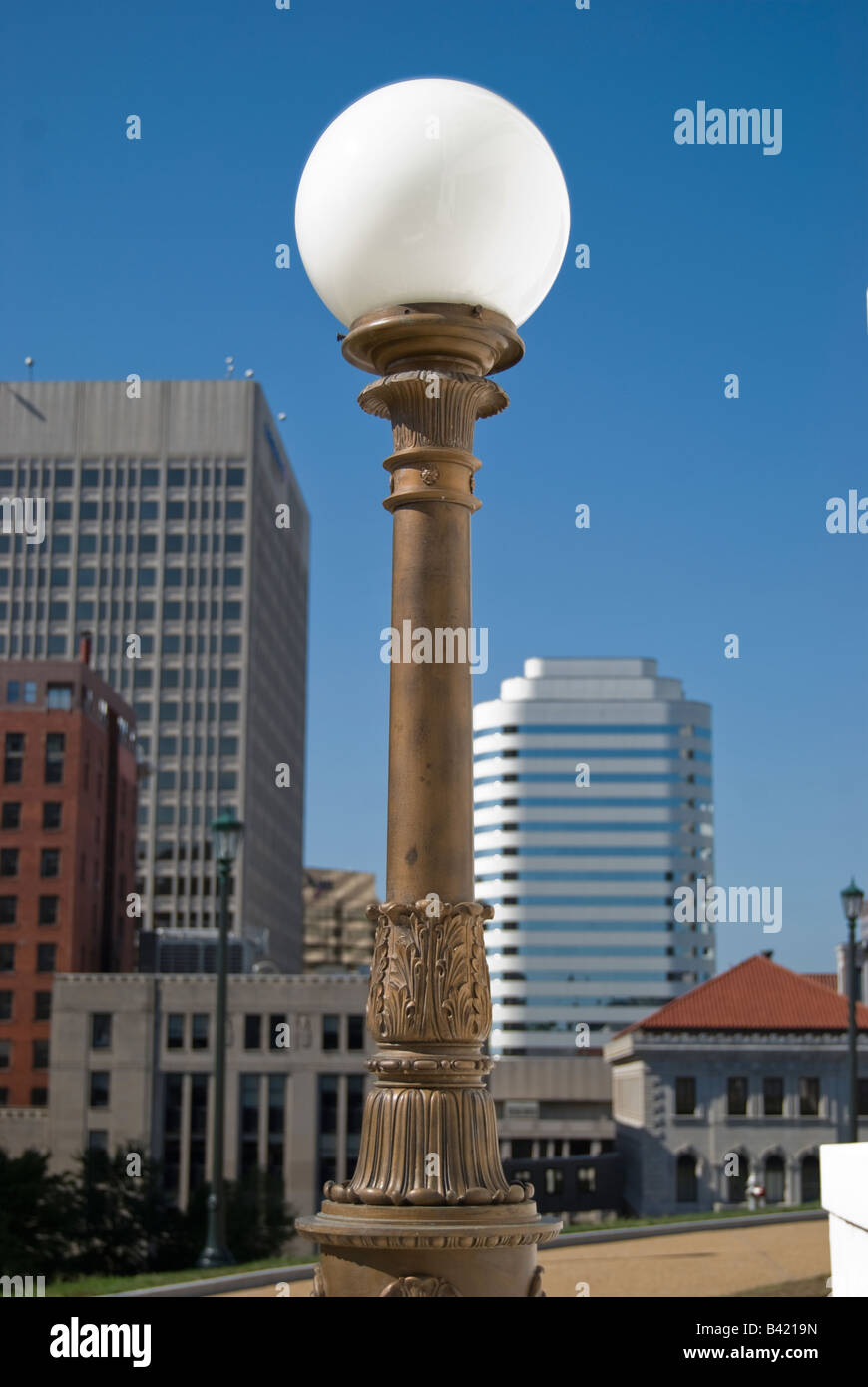 View of downtown Richmond, Virginia from the side steps of the Virginia State Capitol building. Lightpost in foreground. Stock Photo