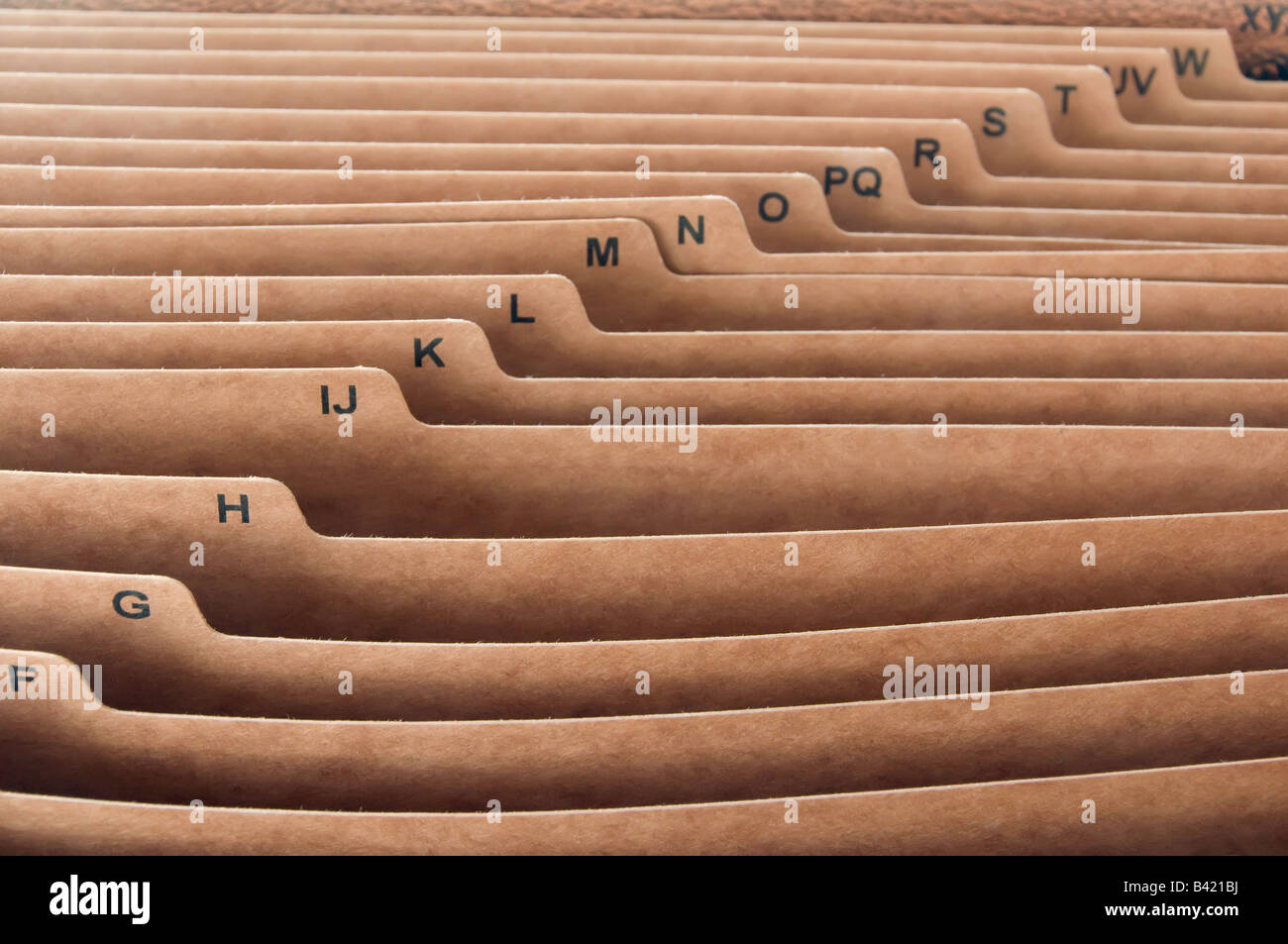 Alphabetized brown office folders Stock Photo - Alamy