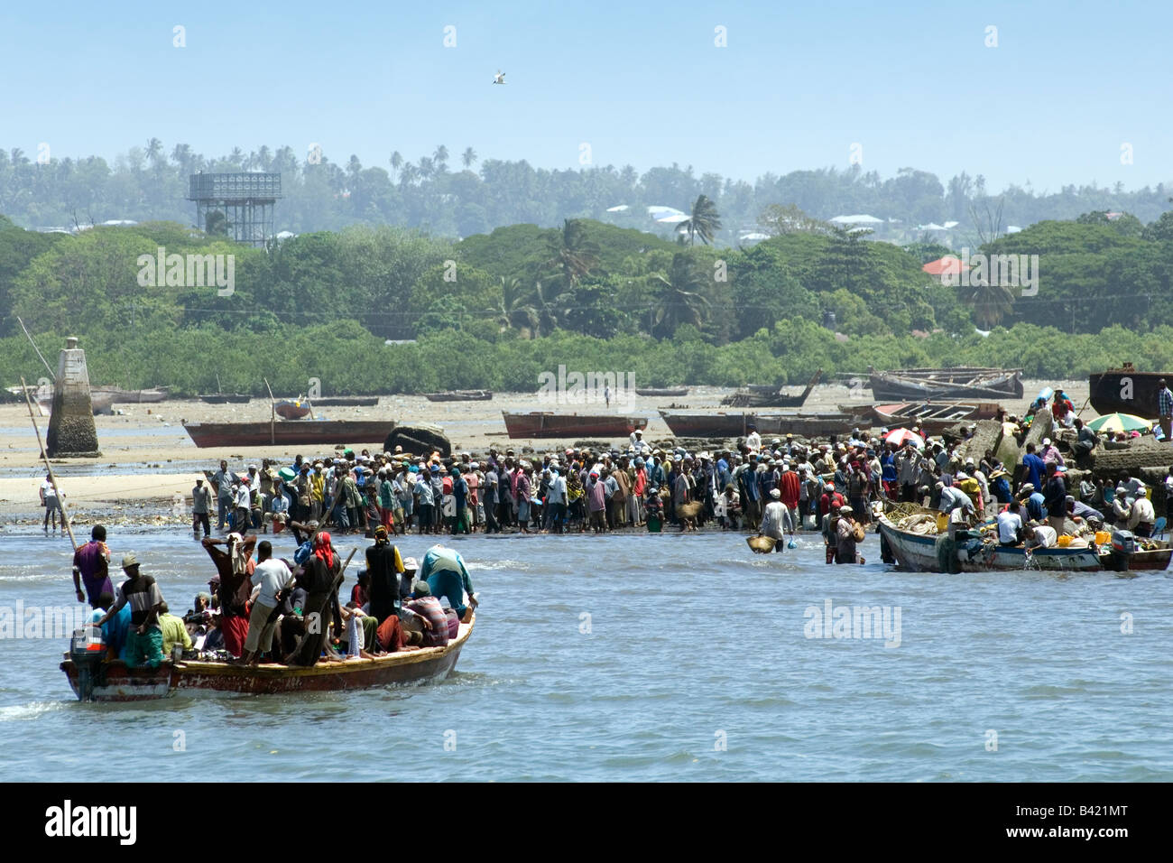 Ferry boat with passengers in crowded Funguni Creek Stone Town Zanzibar Tanzania Stock Photo