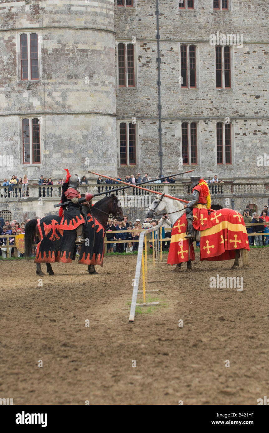 Two knights on horseback prepare for action during a jousting tournament re-enactment at Lulworth Castle in Dorset England UK Stock Photo