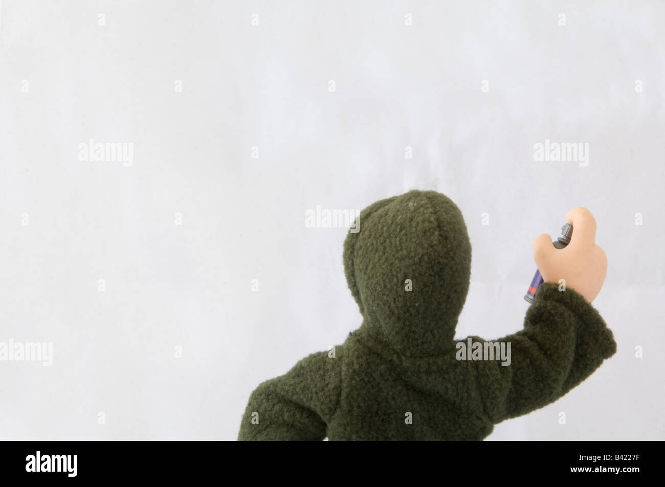 Model of a graffiti artist posed with spray can Stock Photo - Alamy