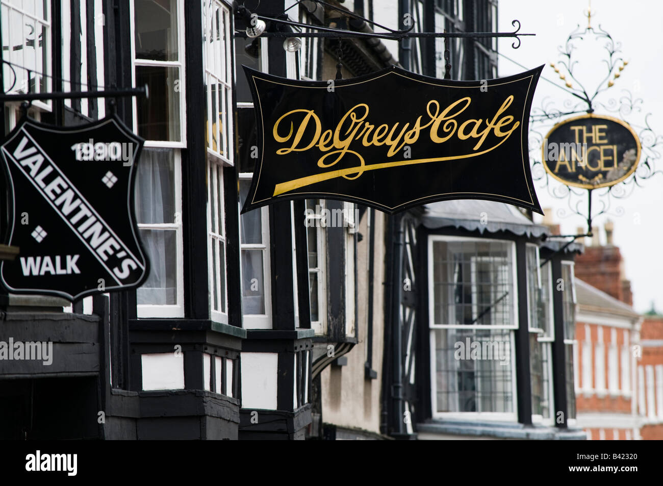 Sign for DeGreys cafe and other businesses in Ludlow town centre Shropshire England UK Stock Photo