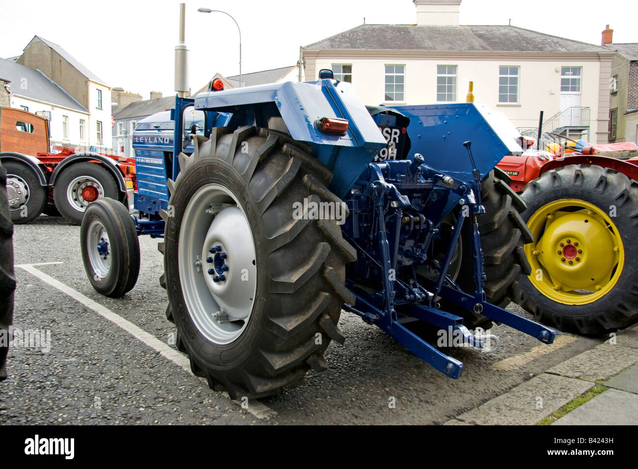 an well maintained old leyland tractor sits among other old tractors Stock Photo