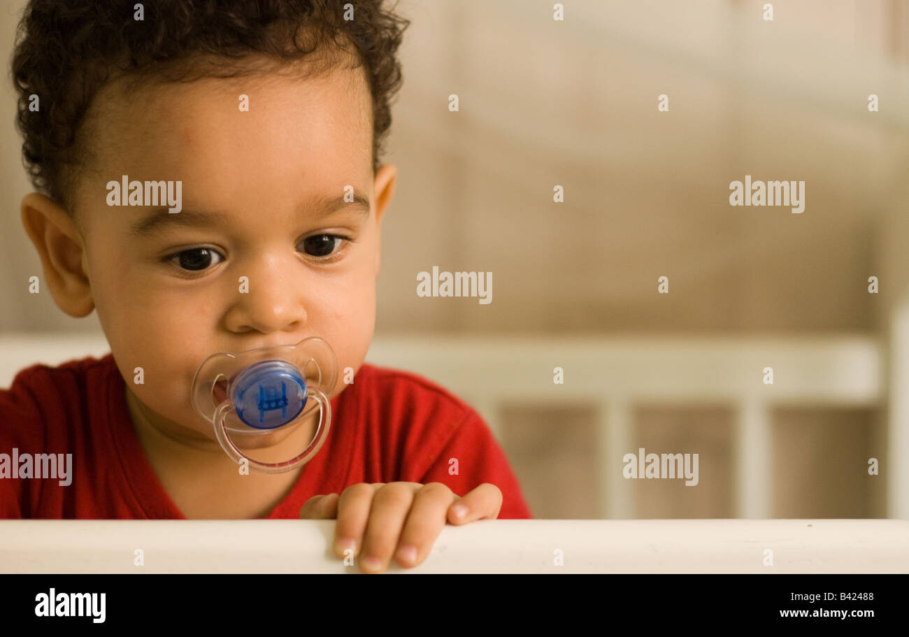 A portrait of a Latin toddler with his pacifier Stock Photo Alamy