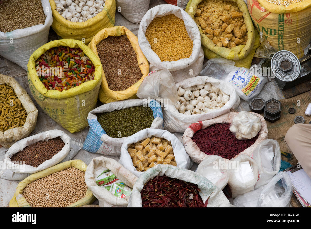 Looking down on indian market stall with sacks of indian spices / produce Stock Photo