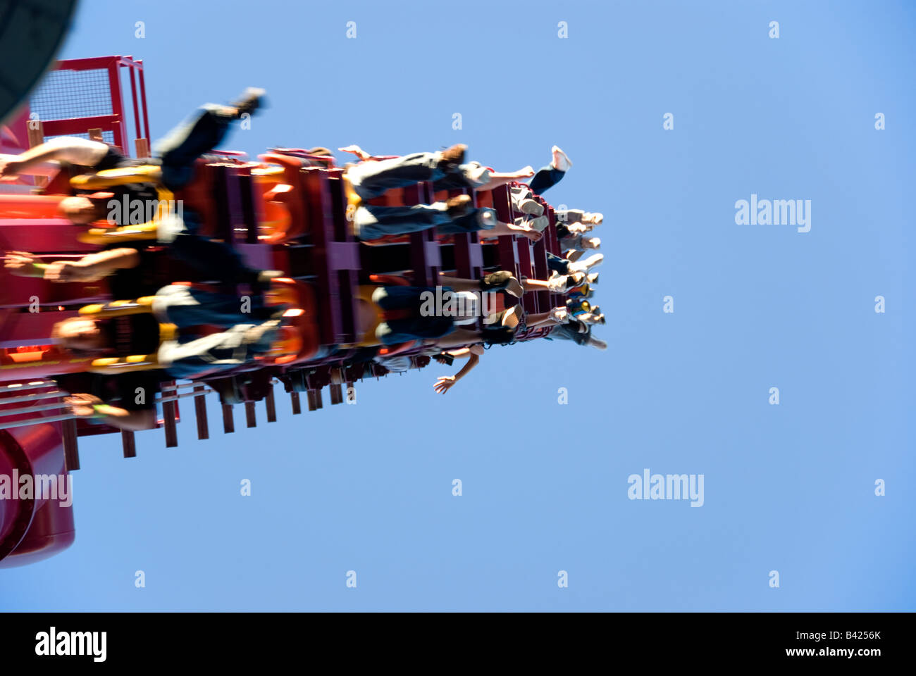 Lumberjack Ride Roller Coaster with peoples legs hanging from the ride Stock Photo - Alamy