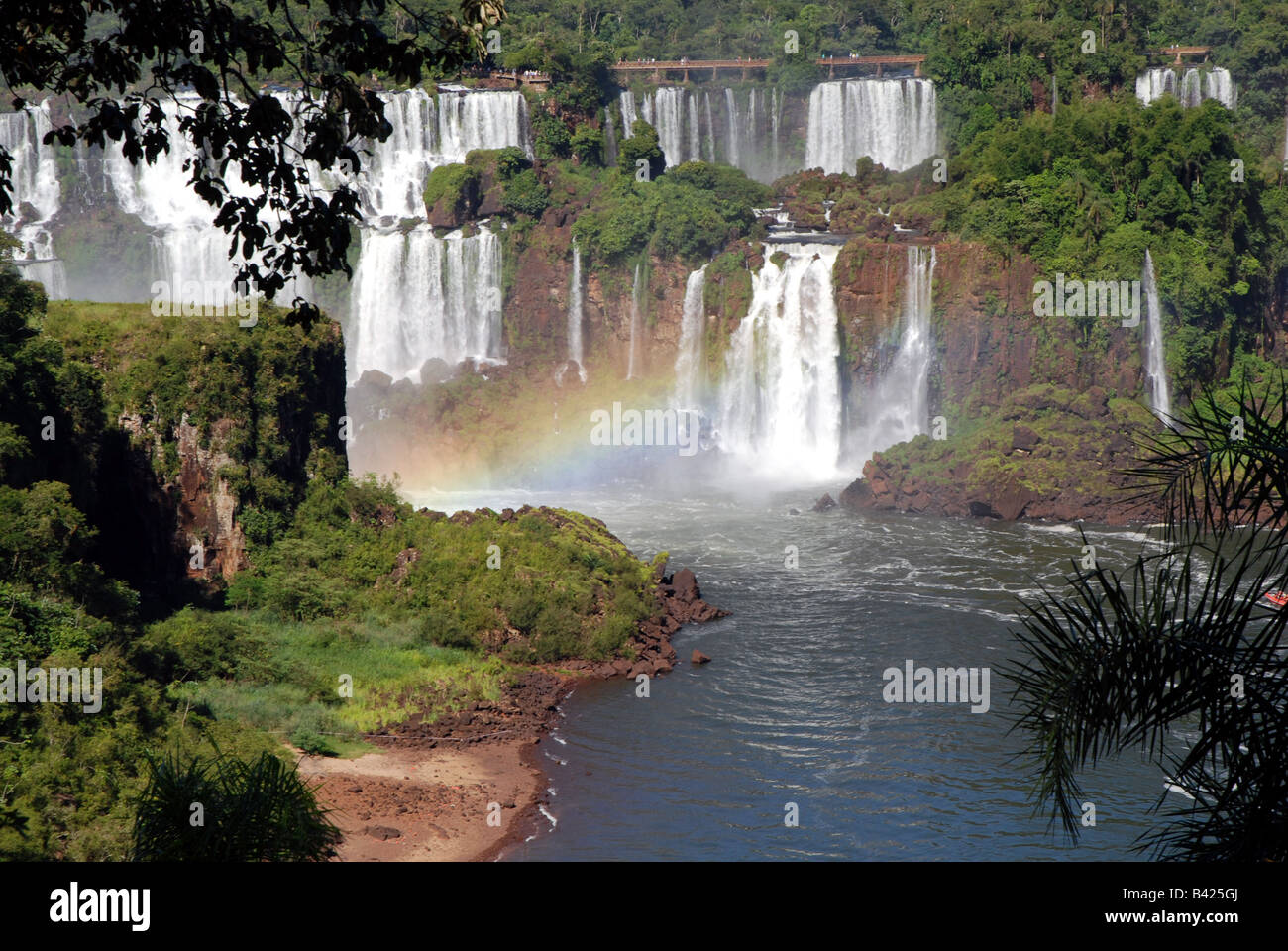 View of Iguazu Falls through a rainbow. Brazil, South America Stock Photo