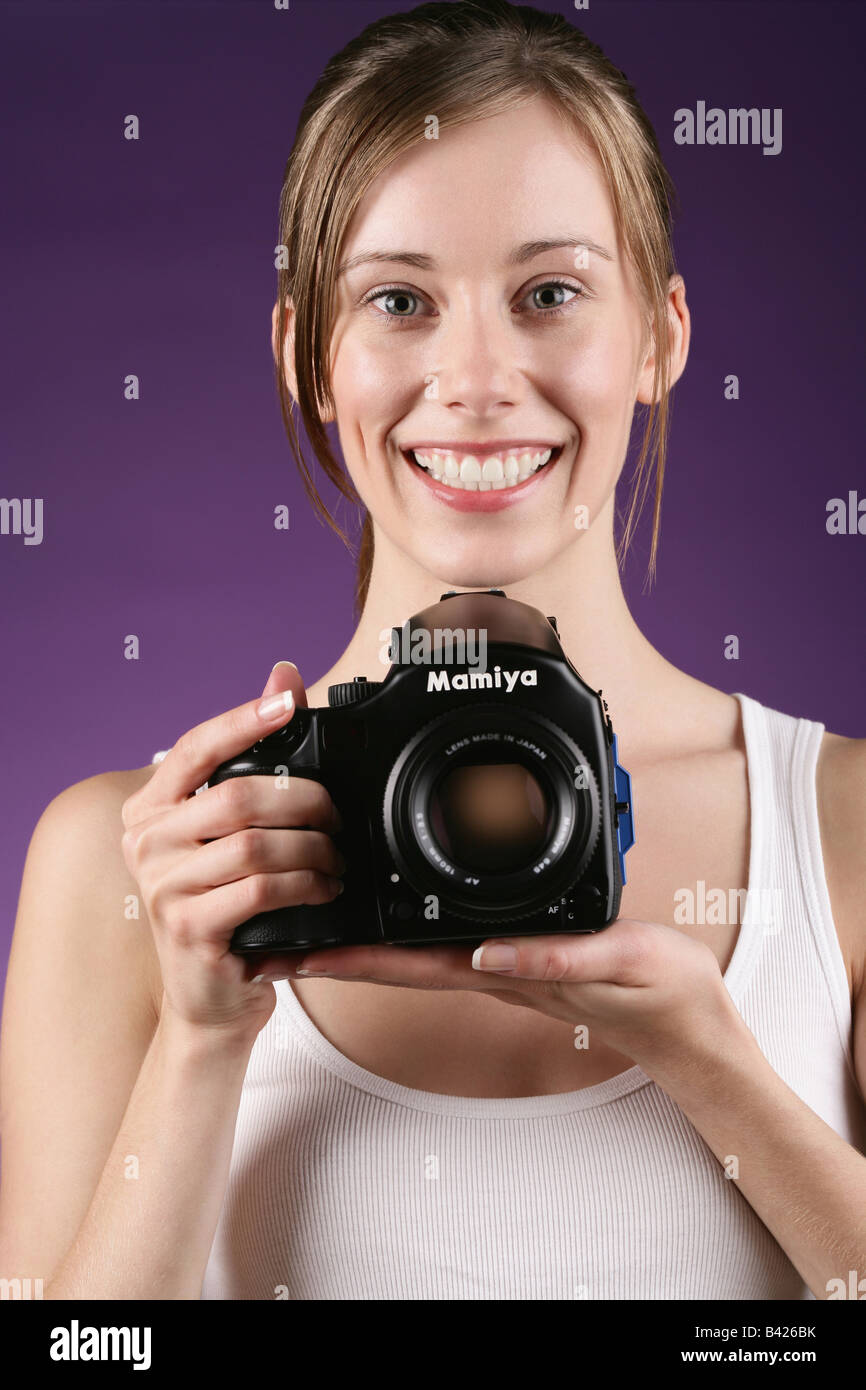 Female model holding a mamiya 645 afd Stock Photo