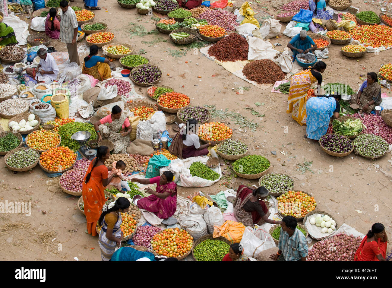 Looking down on indian market stall with vegetable and sacks of indian spices / produce. Puttaparthi, Andhra Pradesh, India Stock Photo