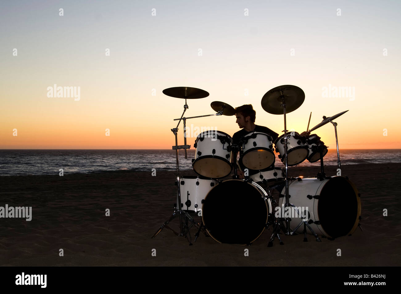 Drummer with Drum set on the beach Stock Photo Alamy