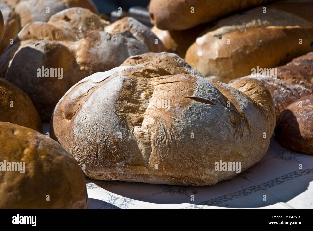 Fresh Milan style bread sits on a table at the farmer s market Stock Photo