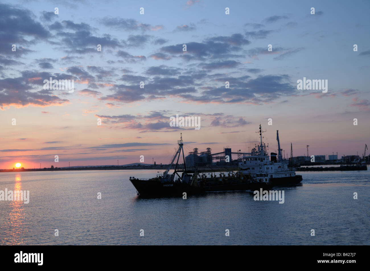 Sunrise over commercial vessel on  Kerch Strait Stock Photo