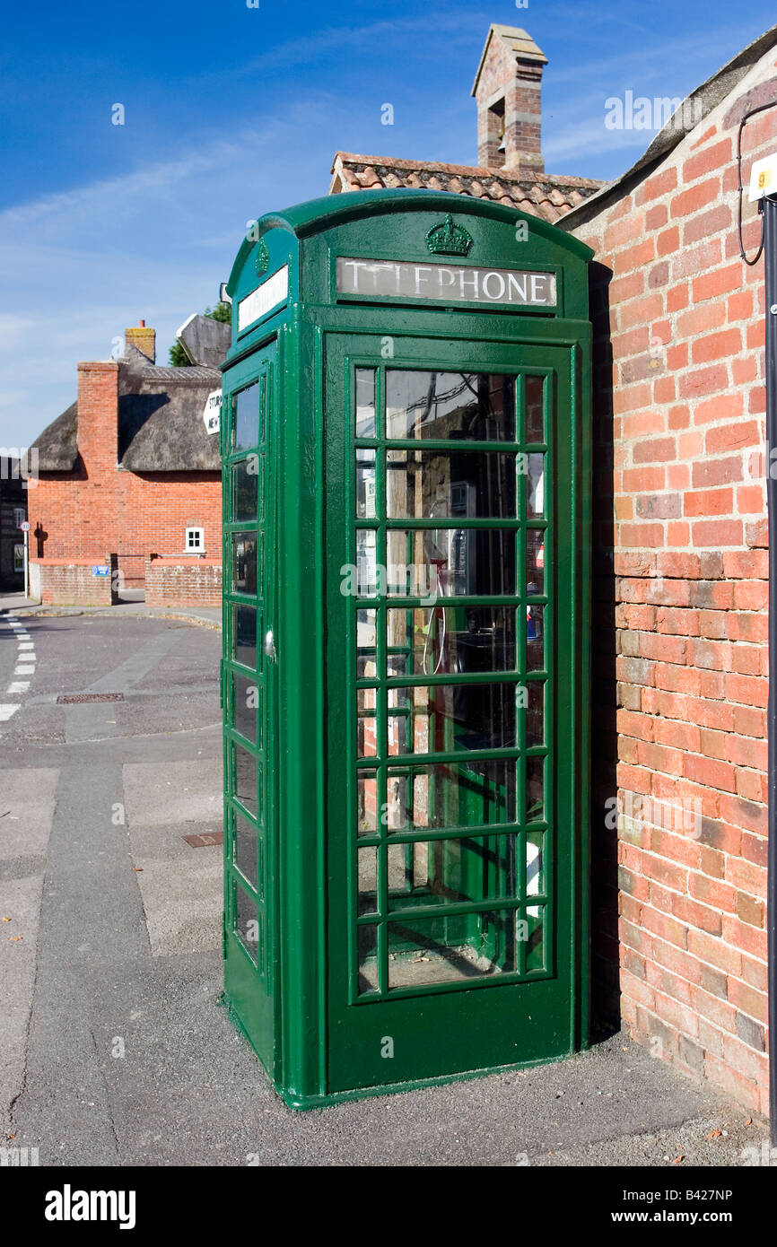 Green K6 telephone kiosk in Okeford Fitzpaine Dorset supposedly painted in the colours of the Pitt-Rivers estate Stock Photo