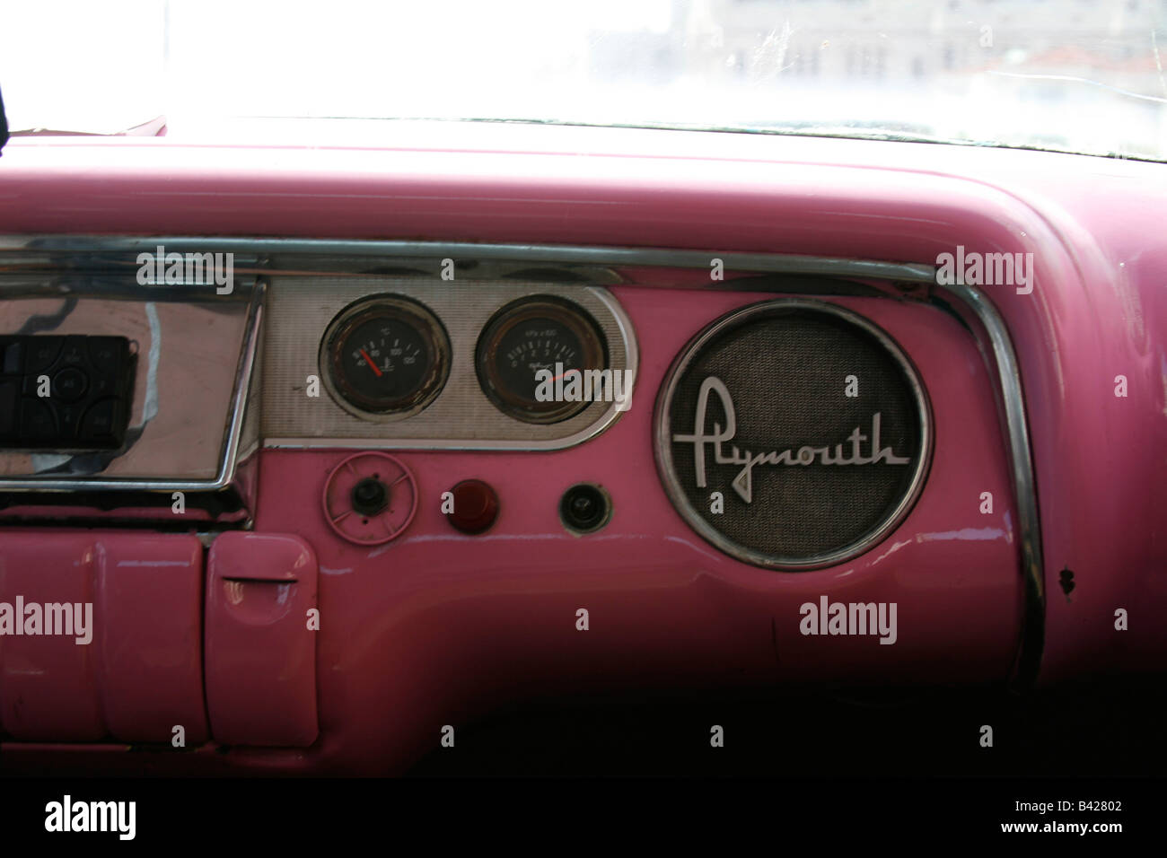 Pink 1950s US car dashboard Stock Photo