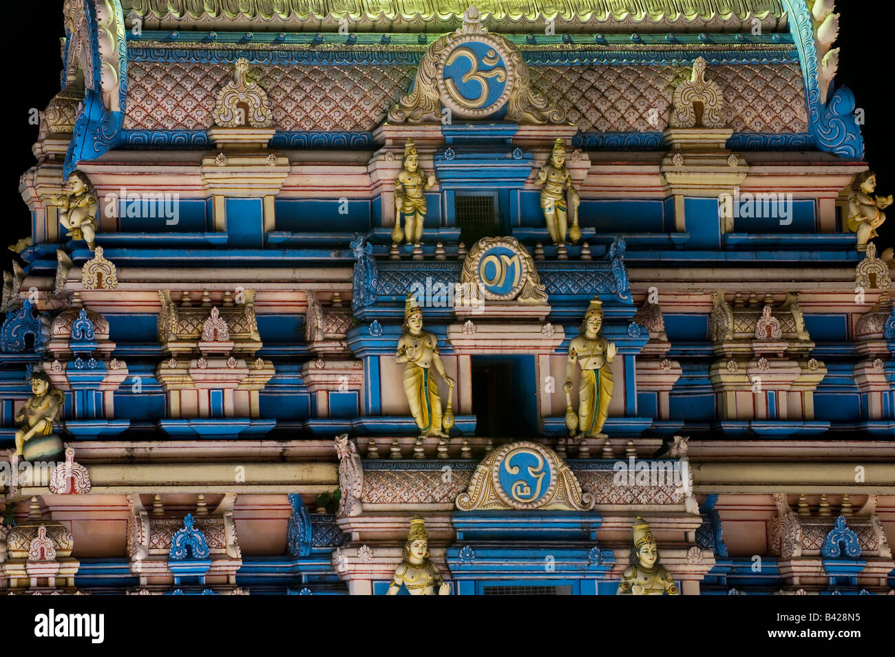 Indian gopuram ashram temple architecture at night in the South Indian town of Puttaparthi. Andhra Pradesh, India Stock Photo