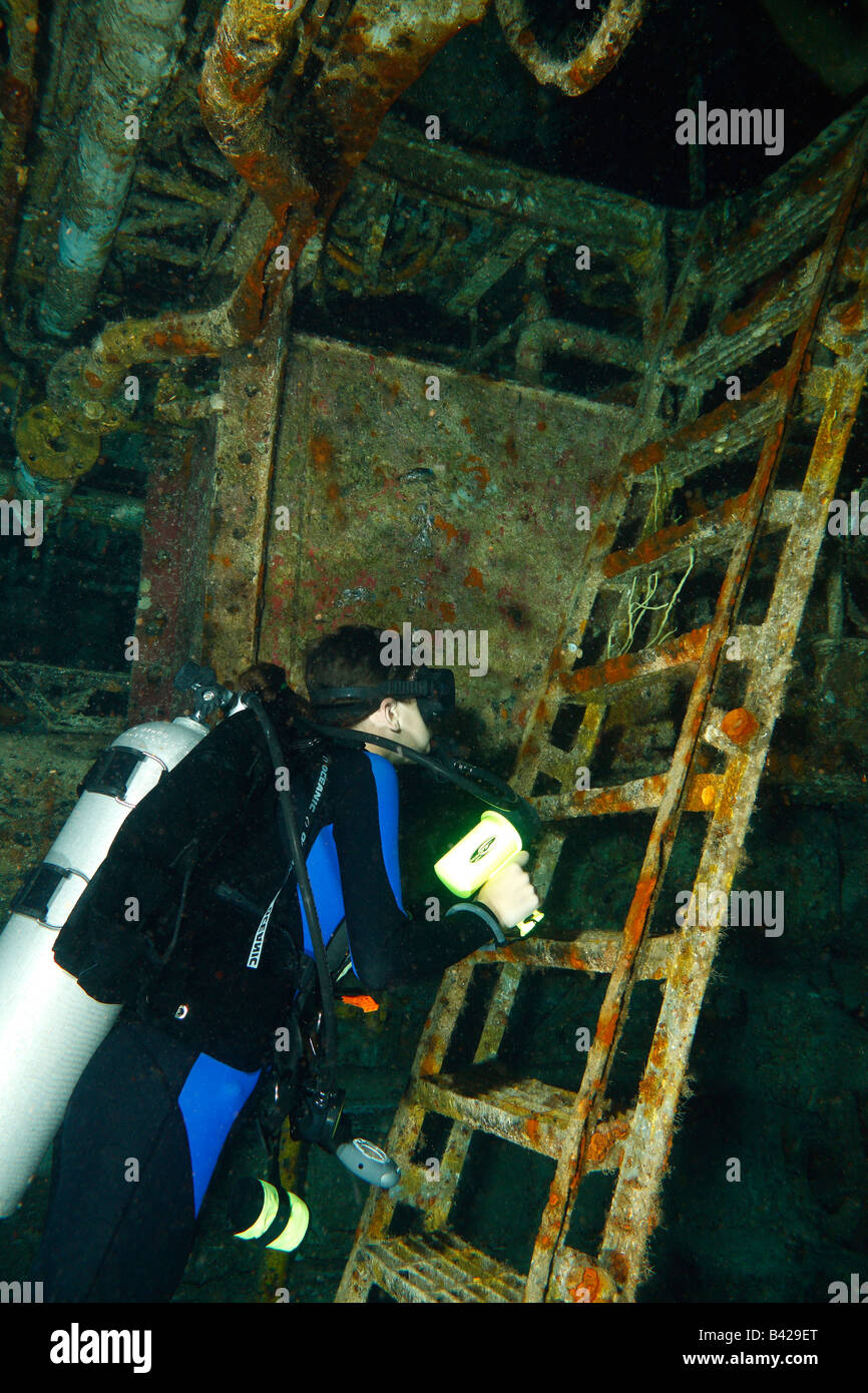 Young teenage female diver exploring the internal compartments of a ship wreck 'Felipe Xicotencatl' Stock Photo