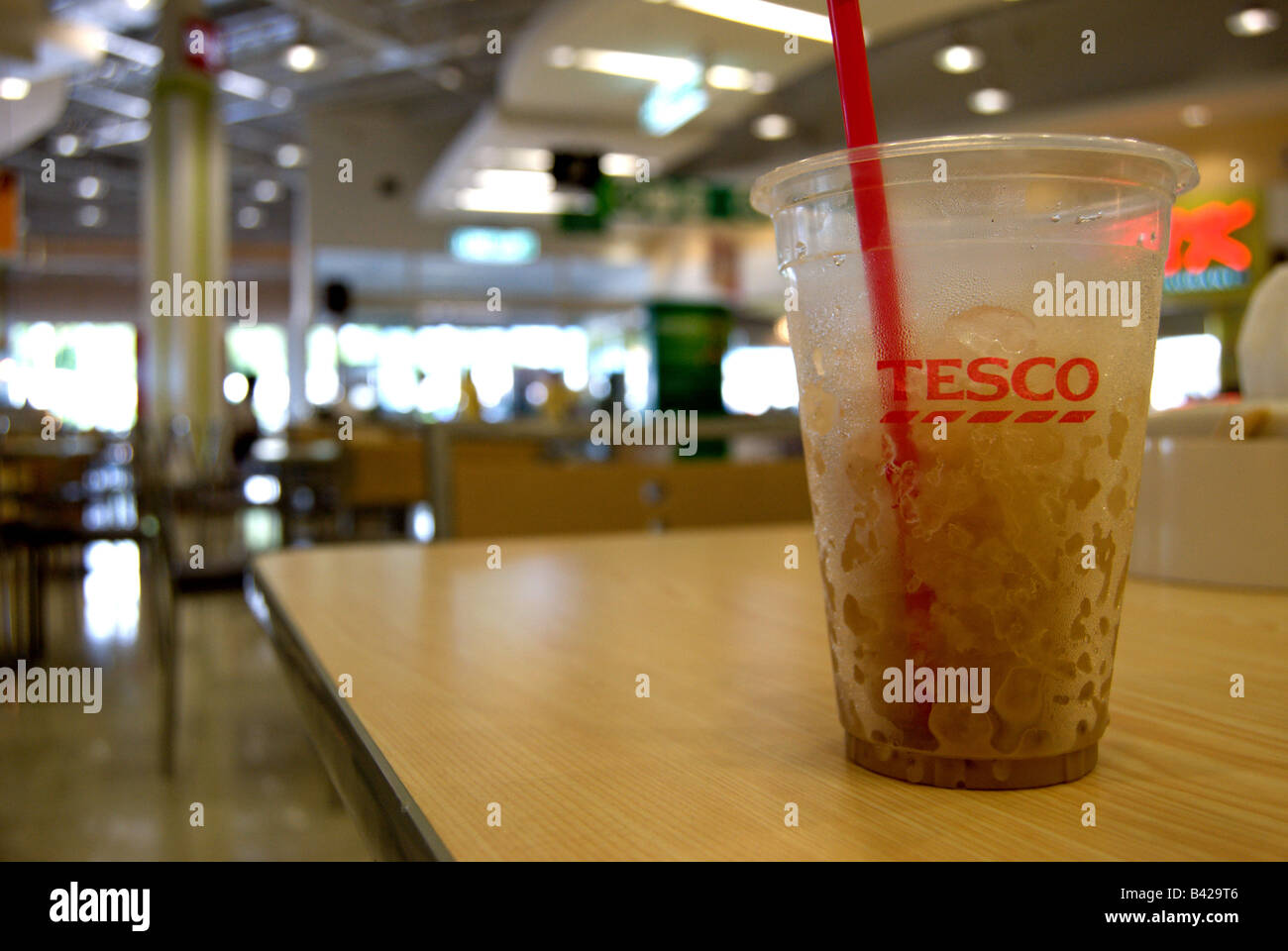 transparent plastic drink container with ice and straw at a tesco