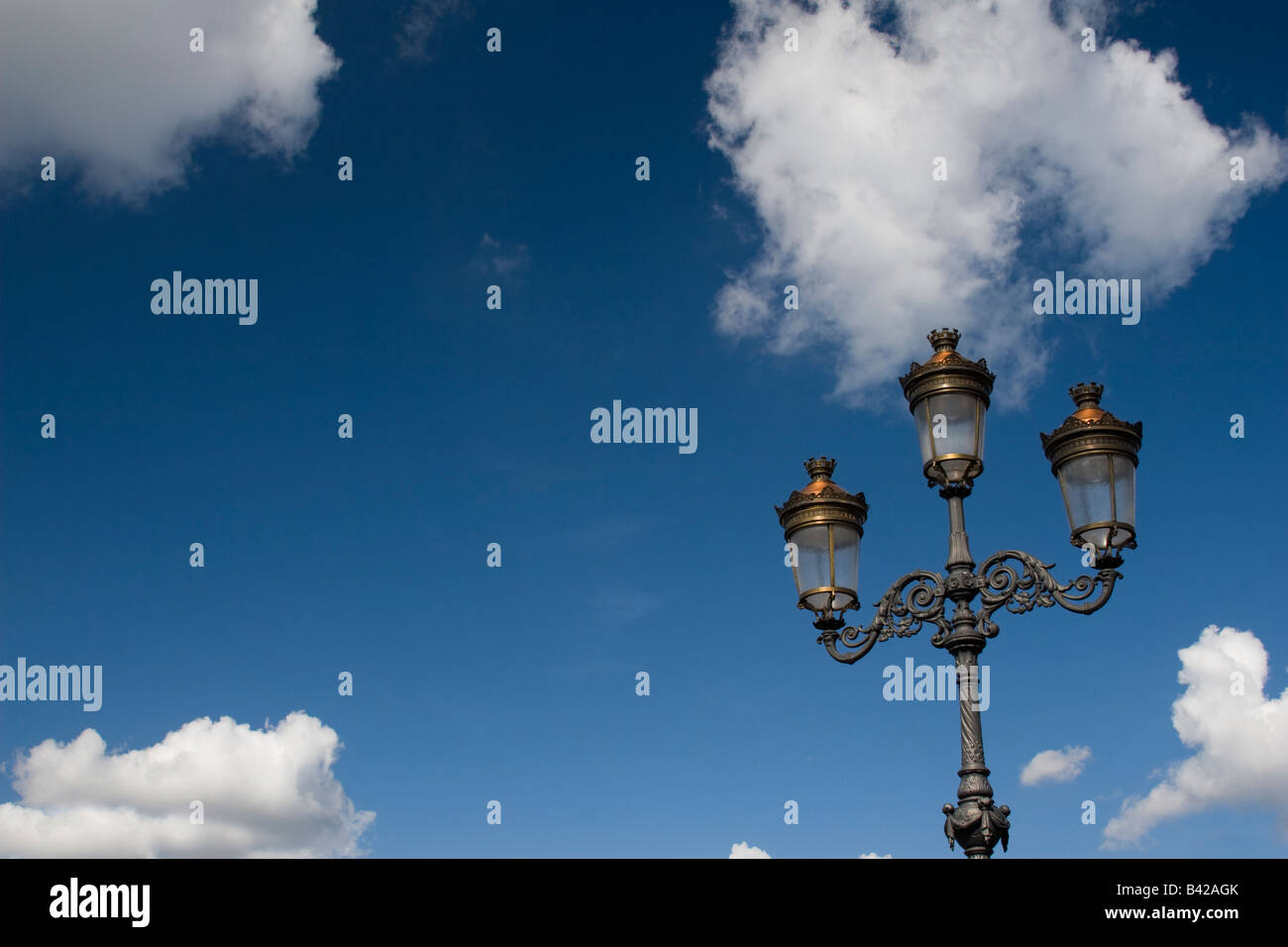 O Connell Bridge Lights Dublin against a deep blue sky with puffy