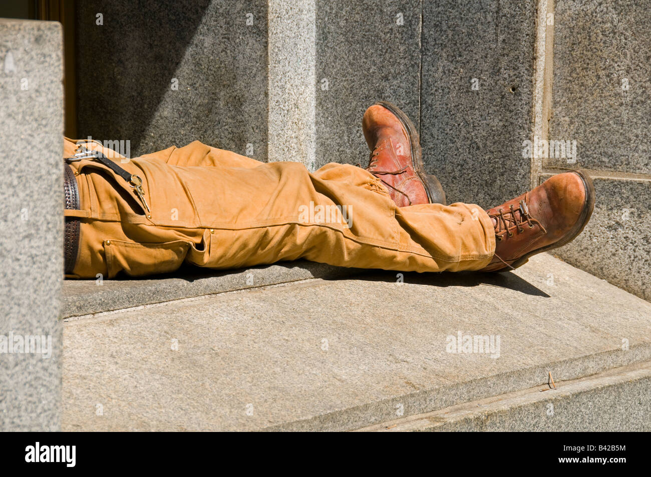 A lost pair of legs on a granite ledge in New York. Stock Photo