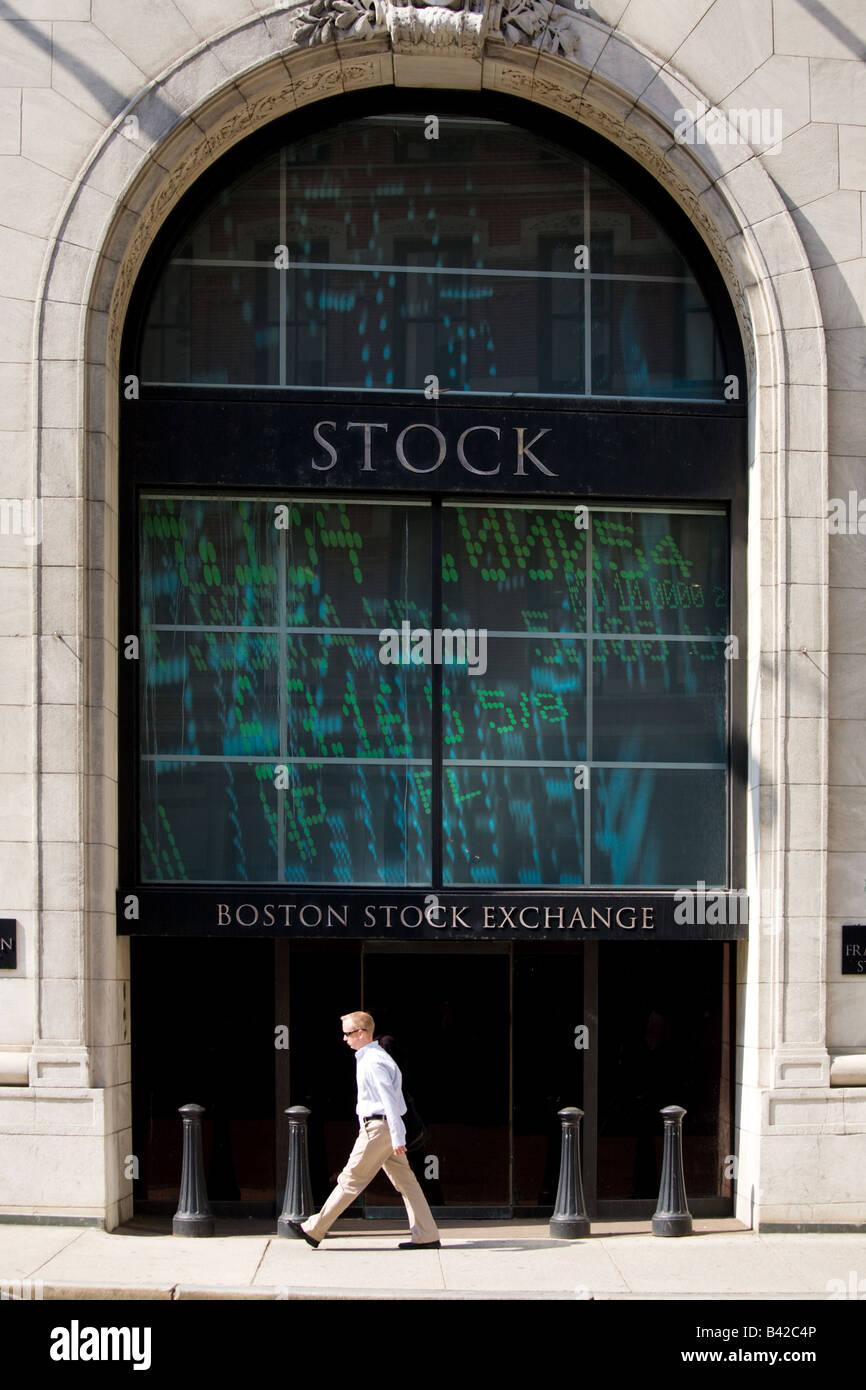A man walking in fornt of the stock exchange building in Boston Stock Photo