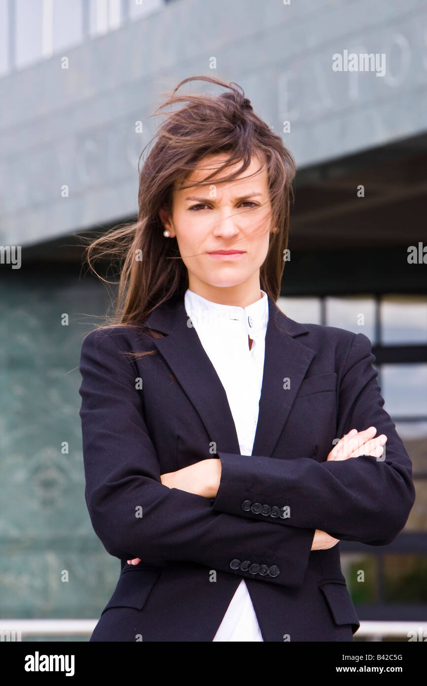 Young serious businesswoman staring at camera Stock Photo