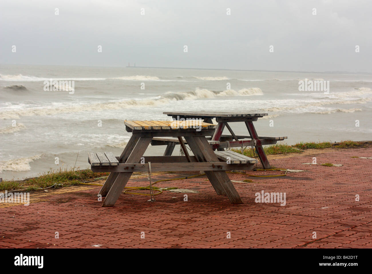 Picnic tables at a deserted beach eating area near Tainan, Taiwan Stock Photo
