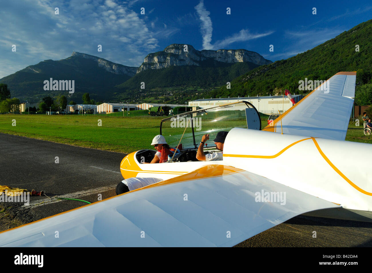 A trainer glider ASK-13 ready to take off  with launch system on runway airfield - France Stock Photo
