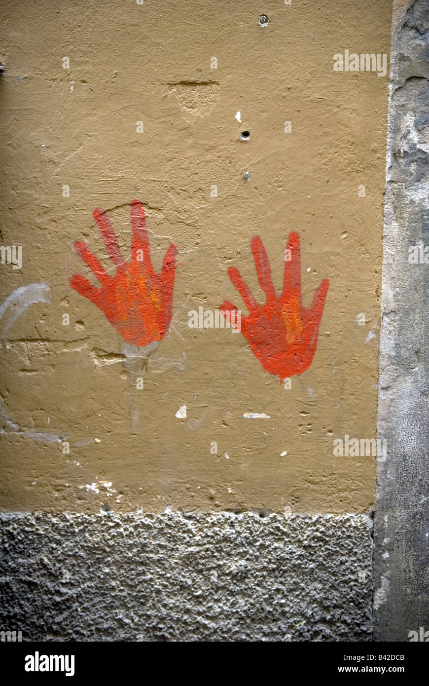 graffiti of two red hands on wall in central bergamo, italy Stock Photo ...