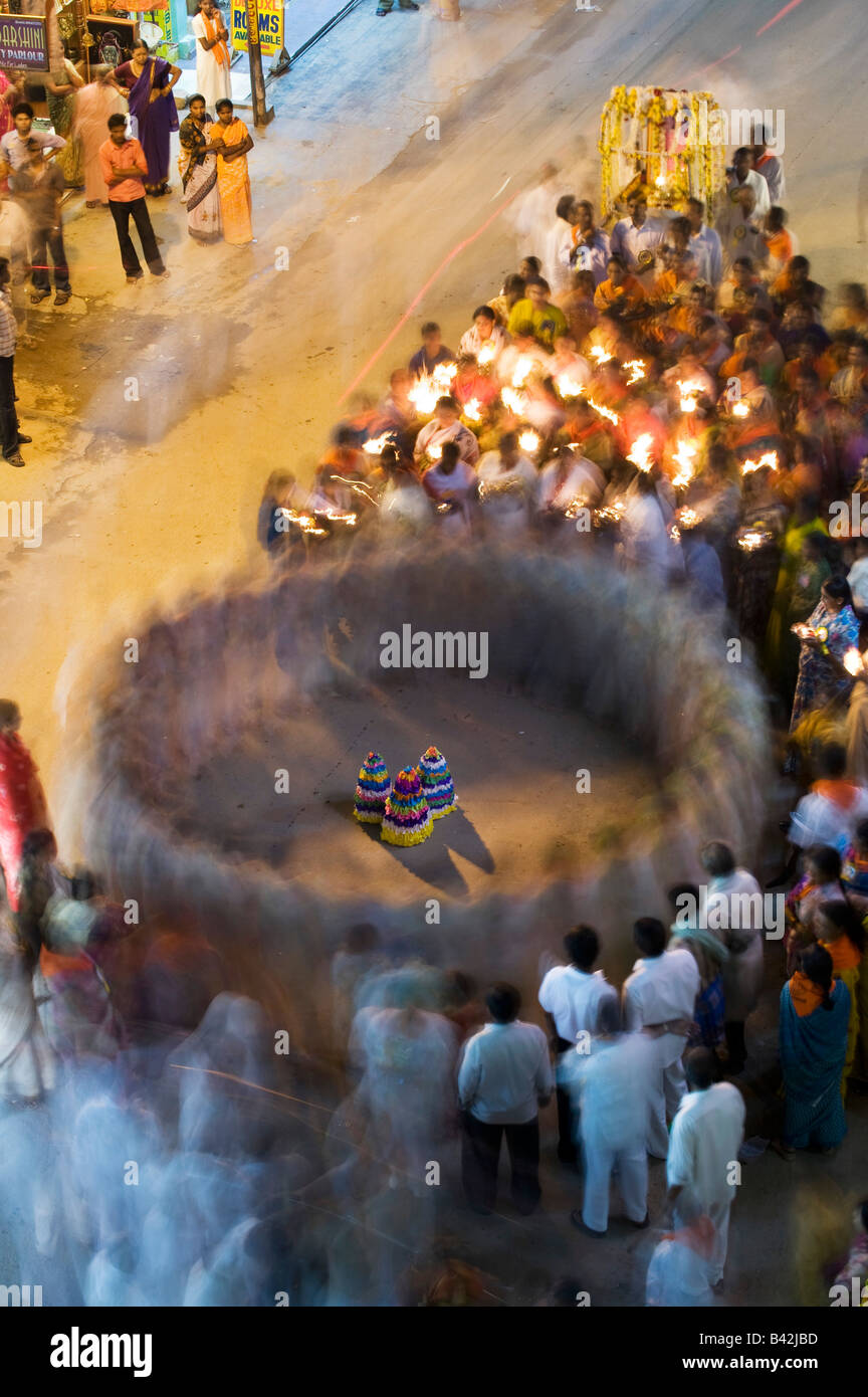 Indian devotees festival dancing in the street at a festival. Puttaparthi, Andhra Pradesh, India. Long exposure Stock Photo