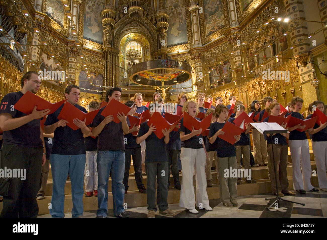 Boys & girls choir sing in the Benedictine Abbey at Montserrat, Santa Maria de Montserrat, near Barcelona, Catalonia, Spain Stock Photo