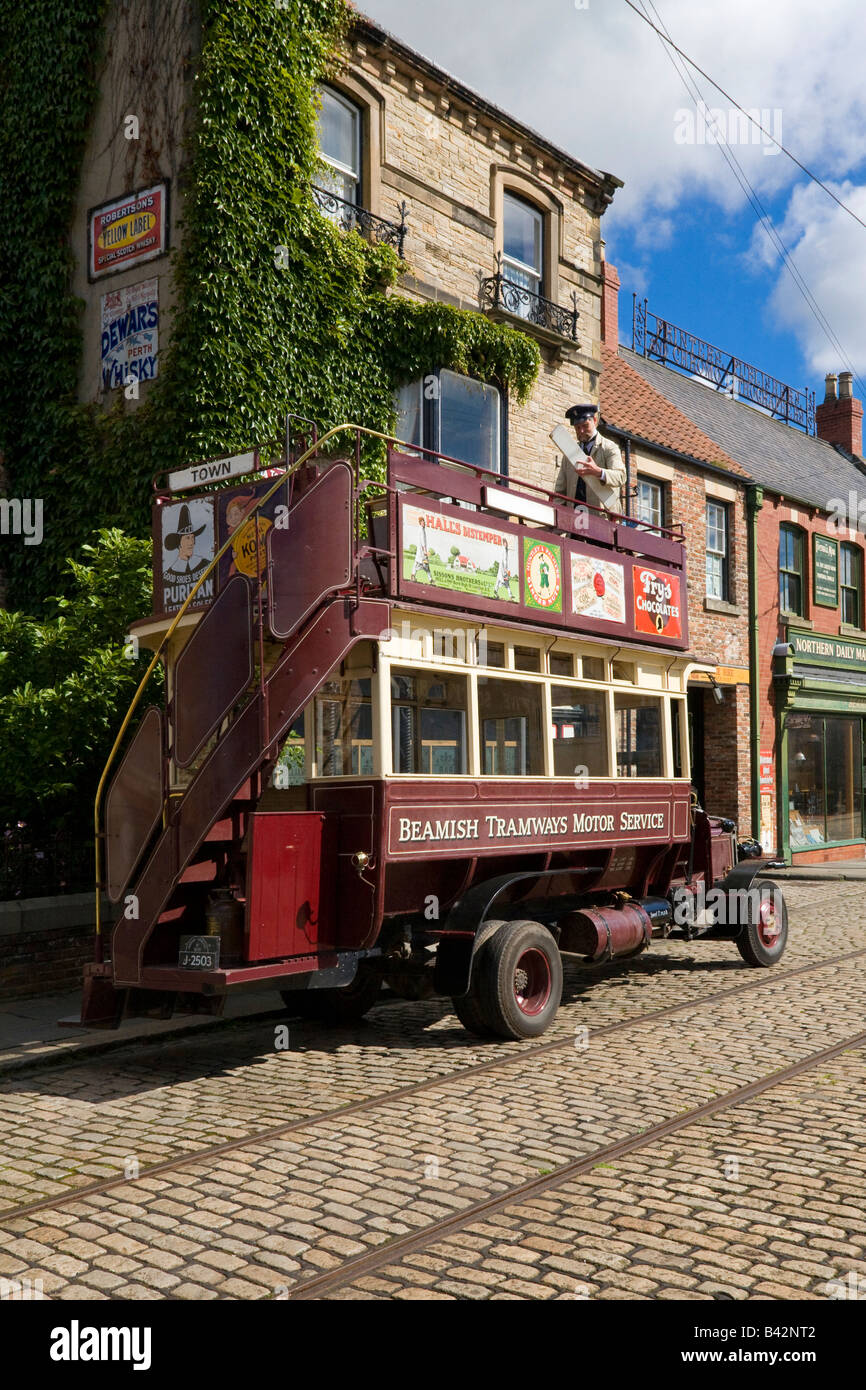 Open Top Double Decker Bus at Beamish Open Air Museum 1913 Town The conductor is changing the destination boards Stock Photo