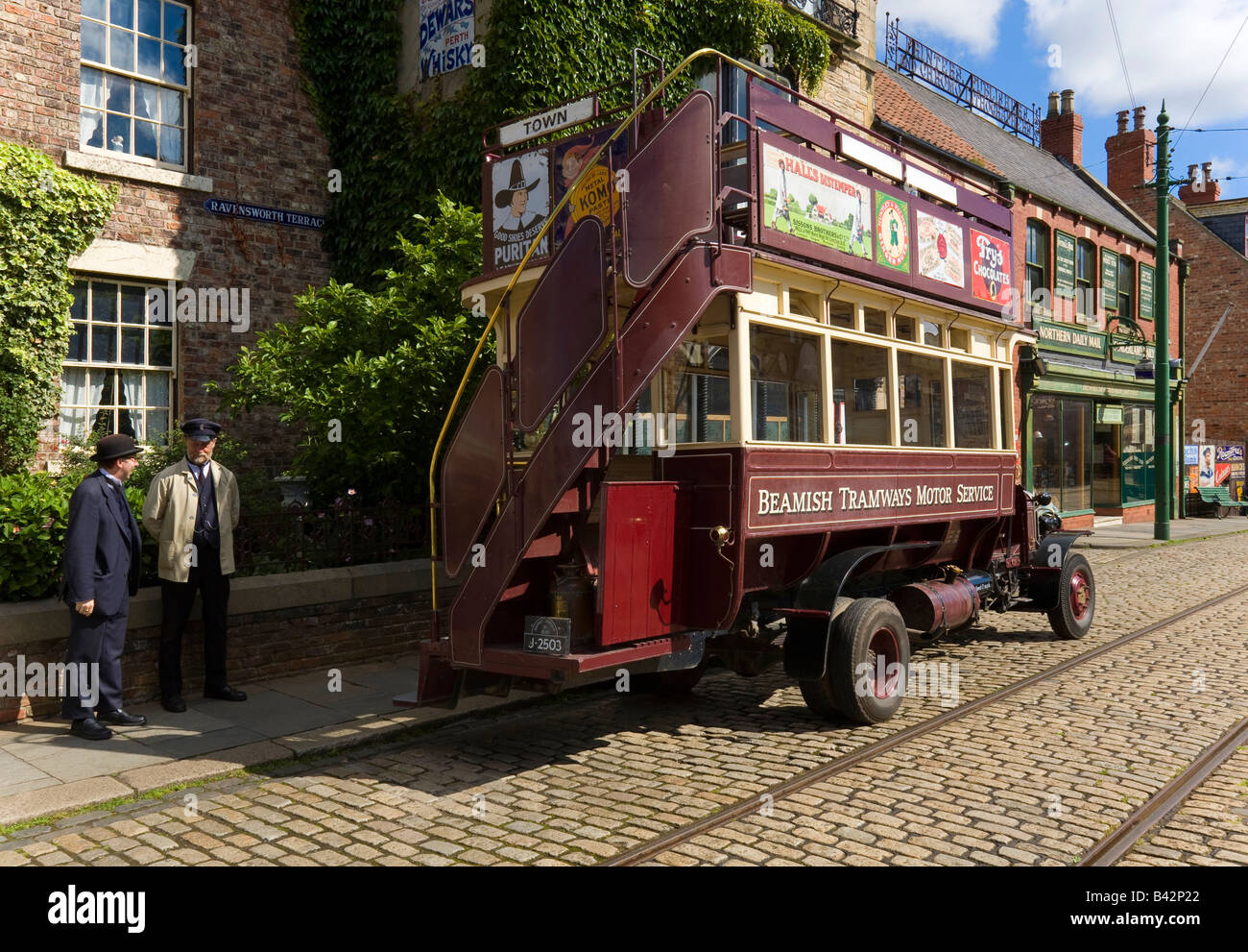 Open Top Double Decker Bus at Beamish Open Air Museum 1913 Town, Conductor talks to his manager Stock Photo