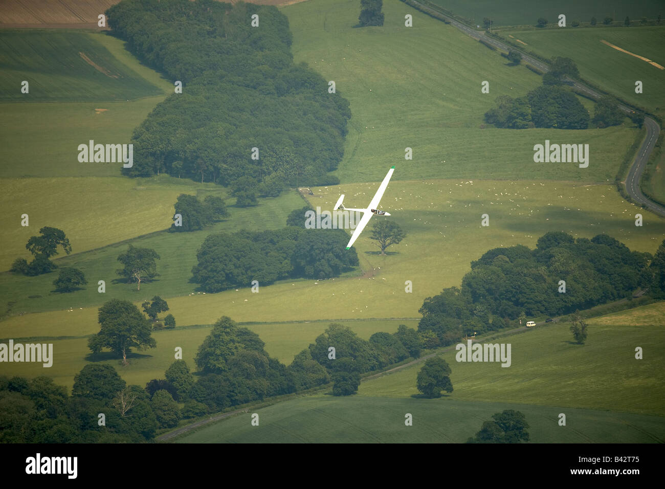 Gliding flying over agricultural farm land near Pocklington Wolds East Yorkshire UK Stock Photo