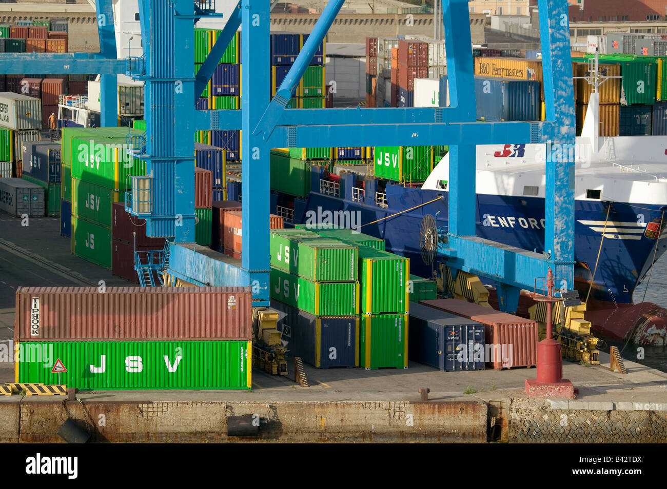 Green cargo containers stacked up at Port of Civitavecchia, Italy, the Port of Rome Stock Photo