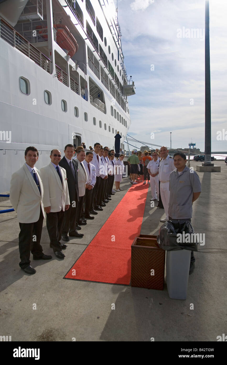 Ships crew of Insignia Oceania Cruise ship giving Red Carpet arrival in Genoa Harbor, Genoa, Italy, Europe Stock Photo