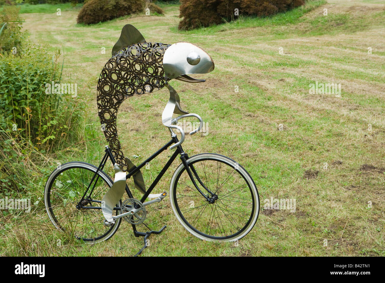 Sculpture of a fish on a bicycle Stock Photo Alamy
