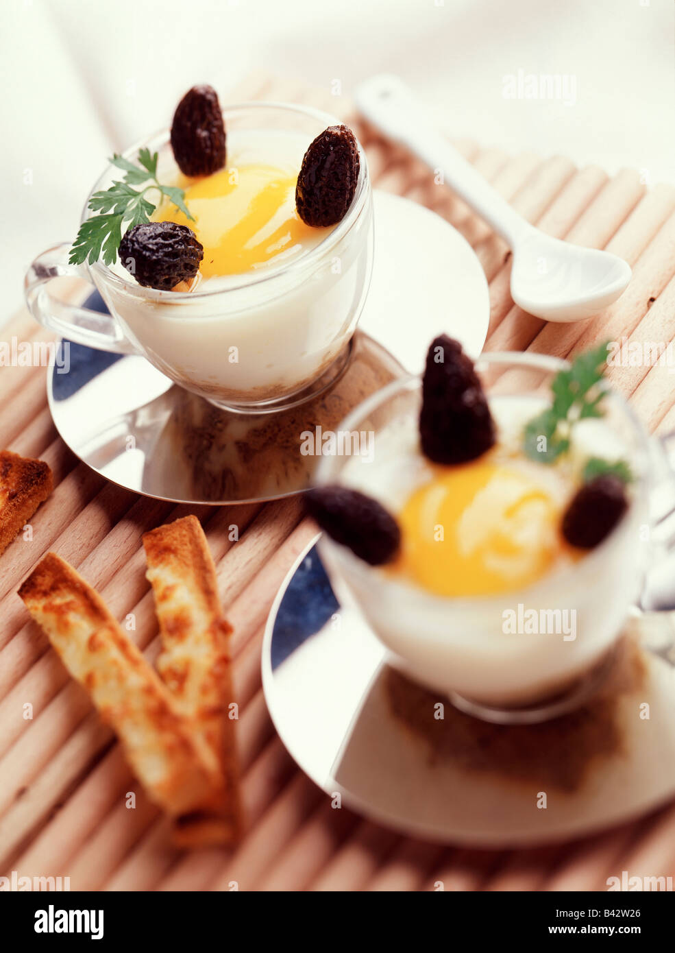 coddled egg with morel mushrooms and grilled soldiers Stock Photo Alamy
