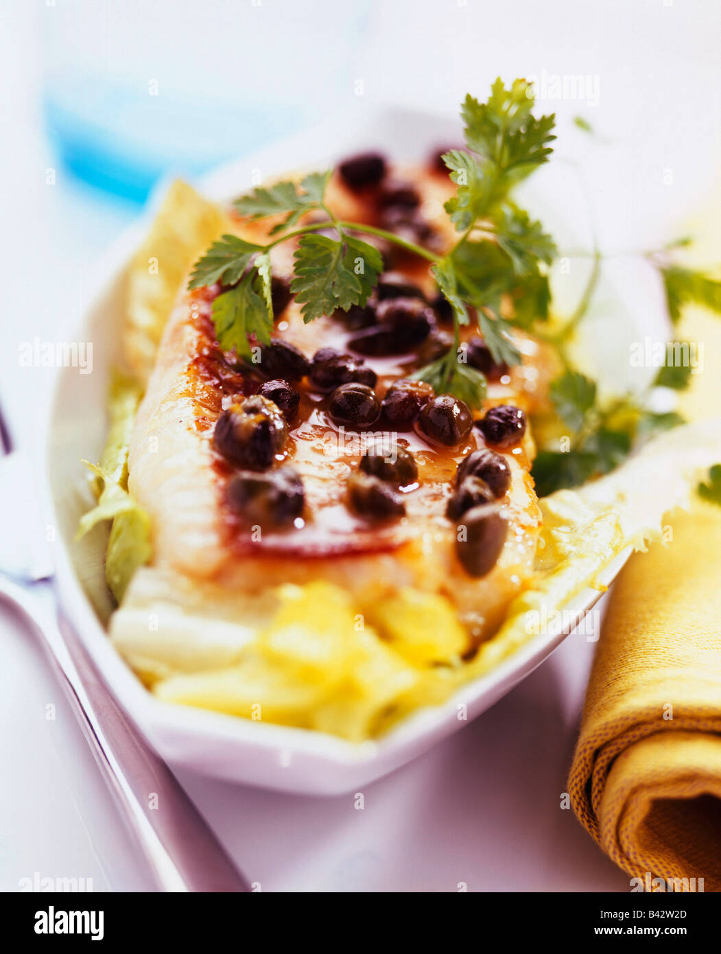 Scorpion Fish Cook scorpion fish fillet with capers Stock Photo - Alamy
