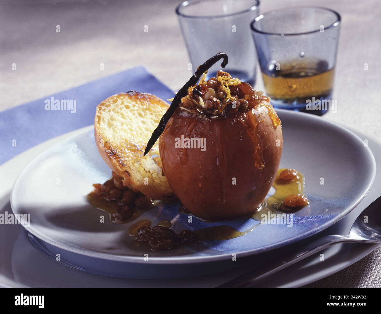 Reinette apple stuffed with mendiant and forest honey Stock Photo