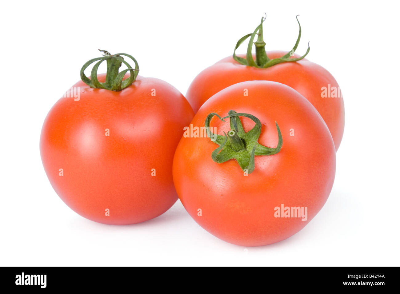 Ripe tomatoes isolated on a white background Stock Photo - Alamy