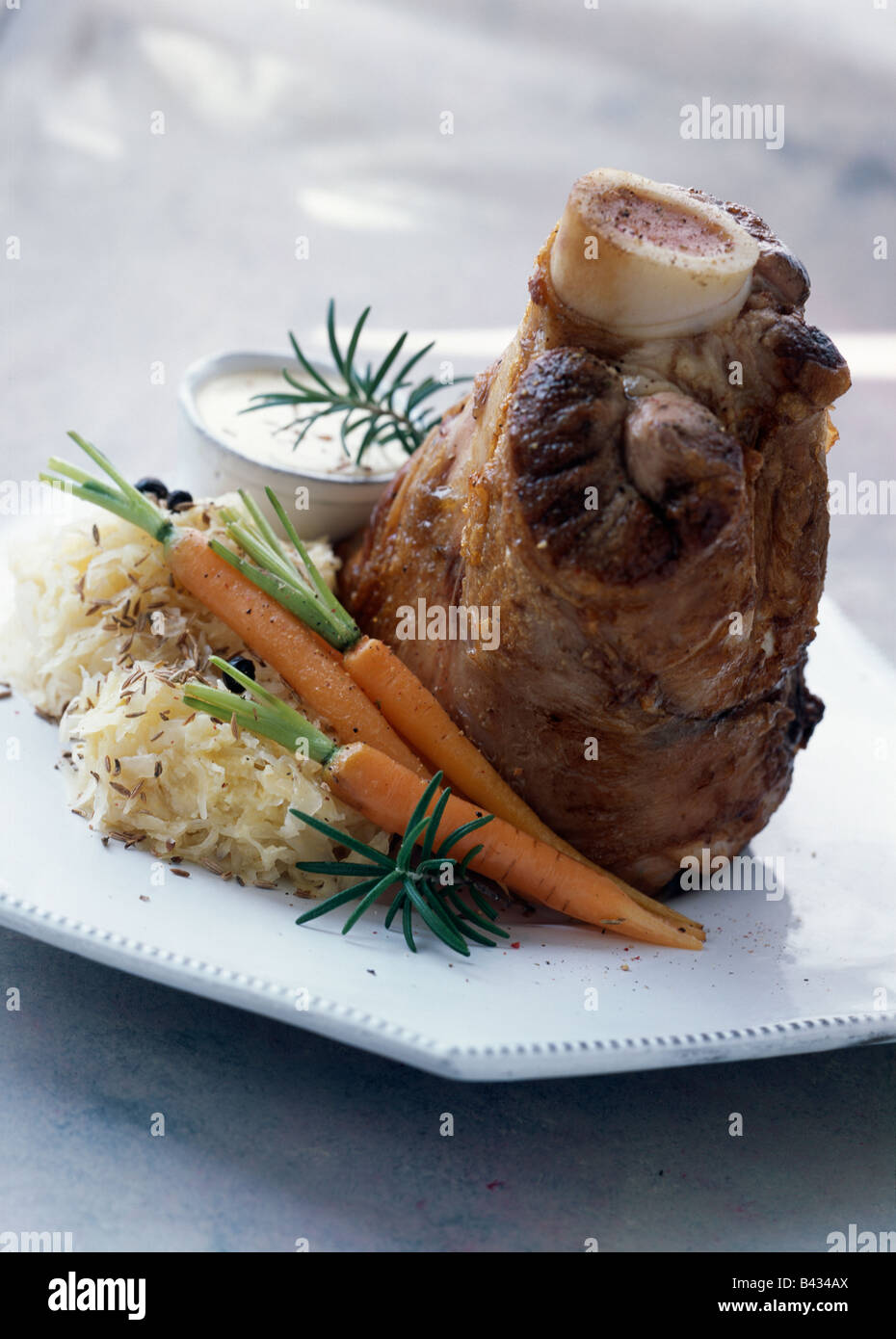 Veal knuckle with Munster cheese sauce Stock Photo Alamy