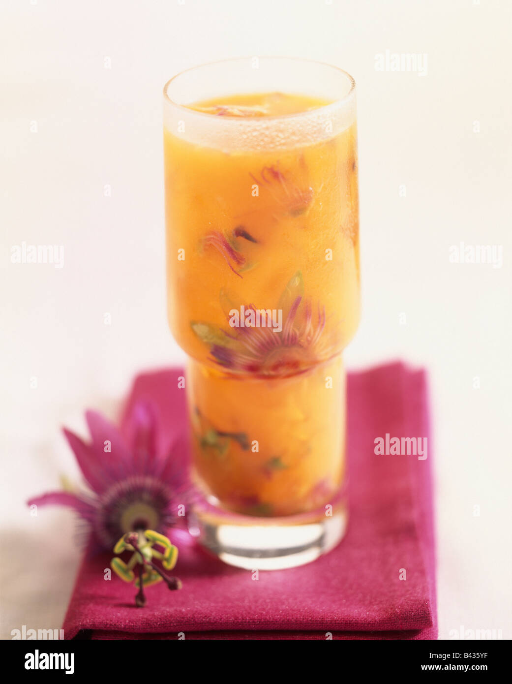 Orange juice with passionfruit flowers Stock Photo Alamy