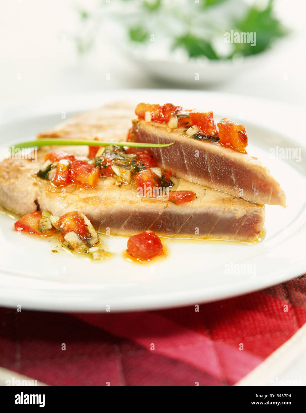 Tuna fillets cooked in the oven with tomatoes Stock Photo Alamy