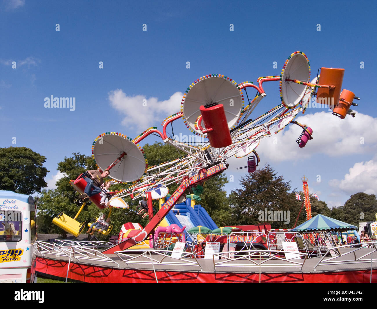 People having fun on an Octopus ride at Findon Sheep Fair, Findon Village, West Sussex, England, UK Stock Photo