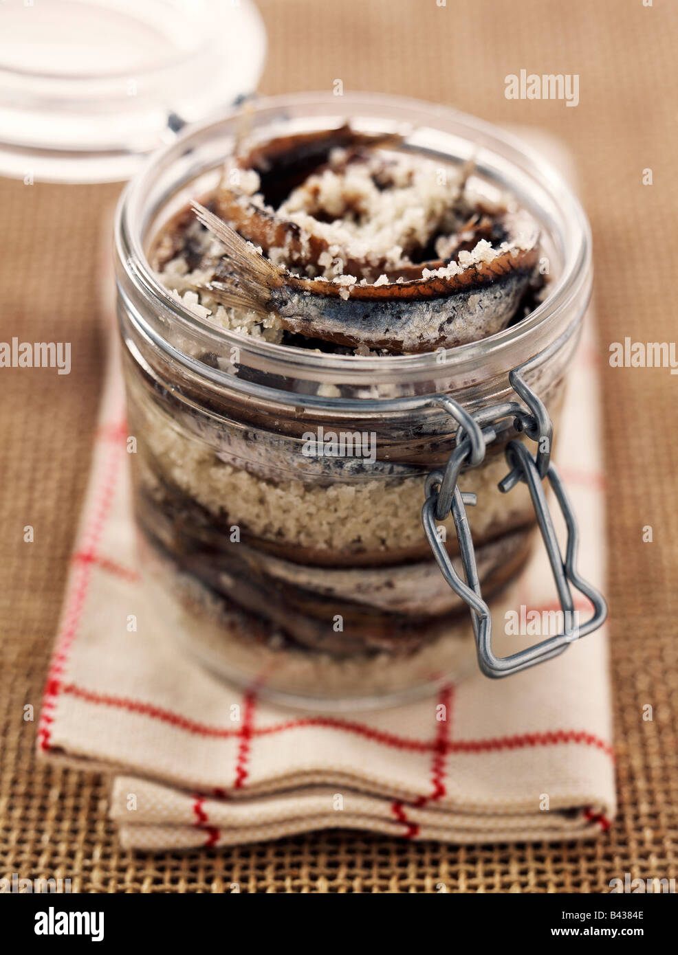jar of anchovies in salt Stock Photo