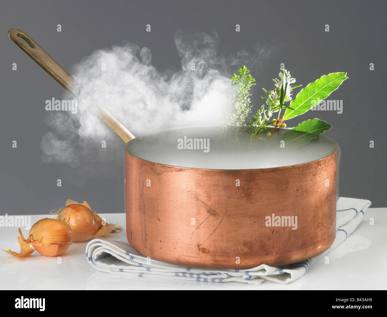 Copper saucepan with steam Stock Photo